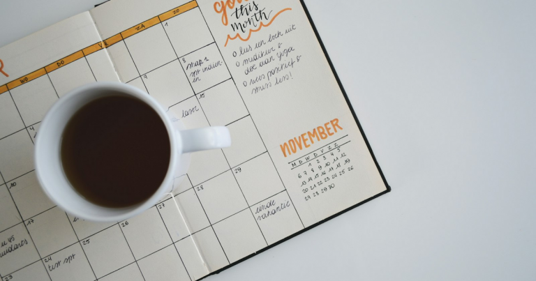 Calendar notebook and planning desk for a morning briefing